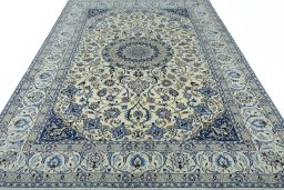 Surface texture of 2000s Nain rug with natural Wool and intricate pattern
