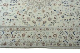 Corner detail of 2000s Nain rug showing border pattern and Wool pile