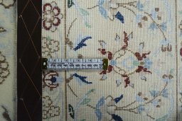 Backside of handmade 2000s Nain rug showing knot structure and weave density