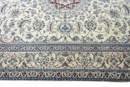 Corner detail of New Nain rug showing border pattern and Cork pile