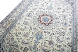 Backside of handmade New Nain rug showing knot structure and weave density