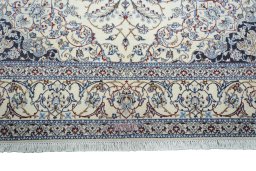 Full view of New Nain rug from Iran / Persia, 306 × 206 cm in Beige tones