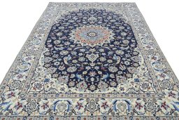 Surface texture of 2000s Nain rug with natural Wool and intricate pattern