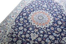 Backside of handmade 2000s Nain rug showing knot structure and weave density