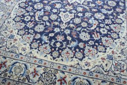 Close-up detail of 2000s Nain rug from Iran / Persia showing Wool weave