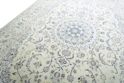 Backside of handmade New Nain rug showing knot structure and weave density