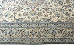 Corner detail of New Nain rug showing border pattern and Cork pile