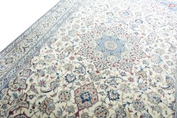 Backside of handmade New Nain rug showing knot structure and weave density