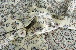Surface texture of 2000s Nain rug with natural Cork and intricate pattern