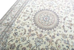 Backside of handmade 2000s Nain rug showing knot structure and weave density