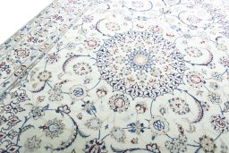 Backside of handmade New Nain rug showing knot structure and weave density