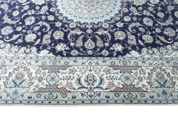 Corner detail of New Nain rug showing border pattern and Cork pile
