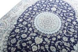 Backside of handmade New Nain rug showing knot structure and weave density
