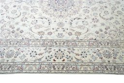 Corner detail of New Nain rug showing border pattern and Wool pile