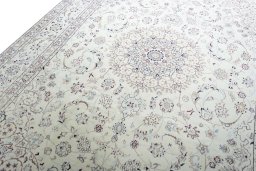Backside of handmade New Nain rug showing knot structure and weave density