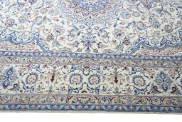 Corner detail of New Nain rug showing border pattern and Wool pile