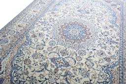 Backside of handmade New Nain rug showing knot structure and weave density