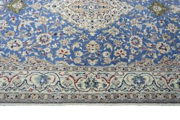 Corner detail of New Nain rug showing border pattern and Cork pile