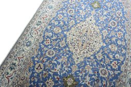 Backside of handmade New Nain rug showing knot structure and weave density