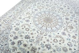 Backside of handmade New Nain rug showing knot structure and weave density