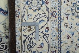 Backside of handmade New Nain rug showing knot structure and weave density