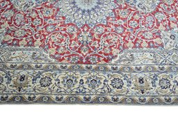Corner detail of 2000s Nain rug showing border pattern and Wool pile