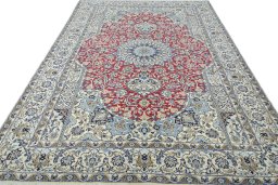 Surface texture of 2000s Nain rug with natural Wool and intricate pattern