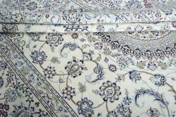 Corner detail of New Nain rug showing border pattern and Wool pile