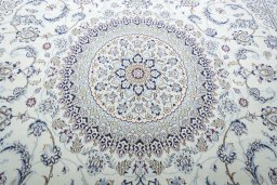 Backside of handmade New Nain rug showing knot structure and weave density