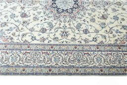Corner detail of New Nain rug showing border pattern and Cork pile