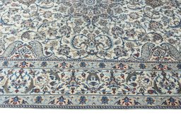 Corner detail of New Nain rug showing border pattern and Wool pile