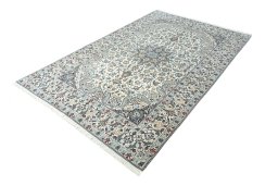 Corner detail of New Nain rug showing border pattern and Wool pile