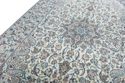 Backside of handmade New Nain rug showing knot structure and weave density