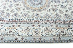 Corner detail of New Nain rug showing border pattern and Wool pile