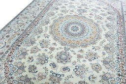 Backside of handmade New Nain rug showing knot structure and weave density