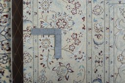 Backside of handmade New Nain rug showing knot structure and weave density