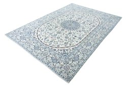 Corner detail of New Nain rug showing border pattern and Wool pile