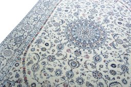 Backside of handmade New Nain rug showing knot structure and weave density