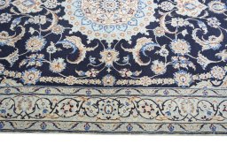 Corner detail of New Nain rug showing border pattern and Wool pile