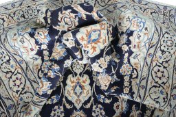 Surface texture of New Nain rug with natural Wool and intricate pattern
