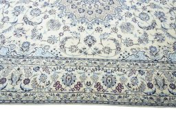 Corner detail of New Nain rug showing border pattern and Wool pile