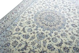 Backside of handmade New Nain rug showing knot structure and weave density
