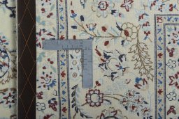 Backside of handmade New Nain rug showing knot structure and weave density