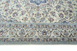 Corner detail of New Nain rug showing border pattern and Wool pile