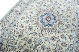 Backside of handmade New Nain rug showing knot structure and weave density