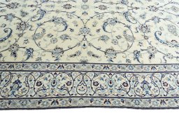 Corner detail of New Nain rug showing border pattern and Wool pile