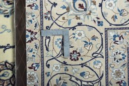 Backside of handmade New Nain rug showing knot structure and weave density