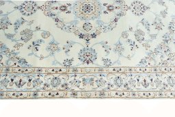 Corner detail of New Nain rug showing border pattern and Cork pile