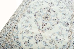 Backside of handmade New Nain rug showing knot structure and weave density