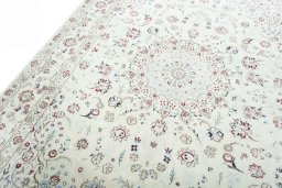 Backside of handmade New Nain rug showing knot structure and weave density